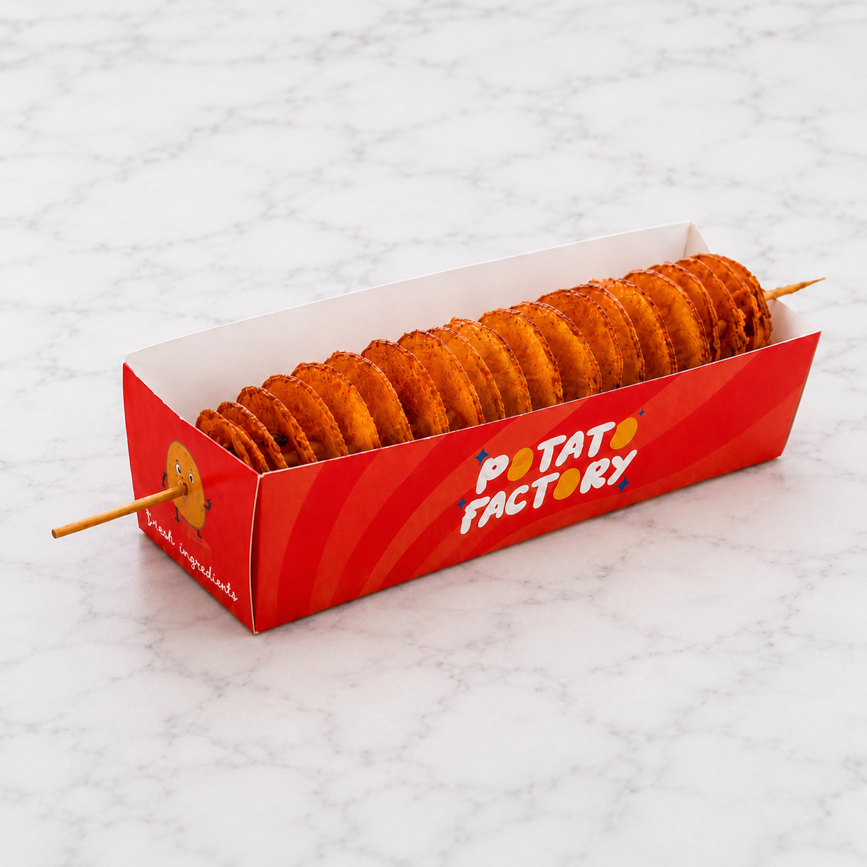 red box of Potato Factory TornadoPotato on a white marble surface