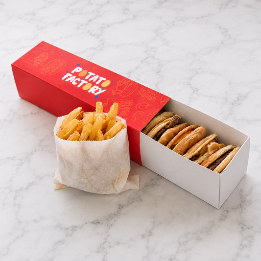 CrunchyChipsBurger in a Red box from 'Potato Factory' containing fries and crunchy burger rings on a marble surface