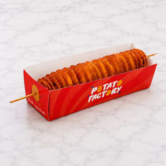 red box of Potato Factory TornadoPotato on a white marble surface